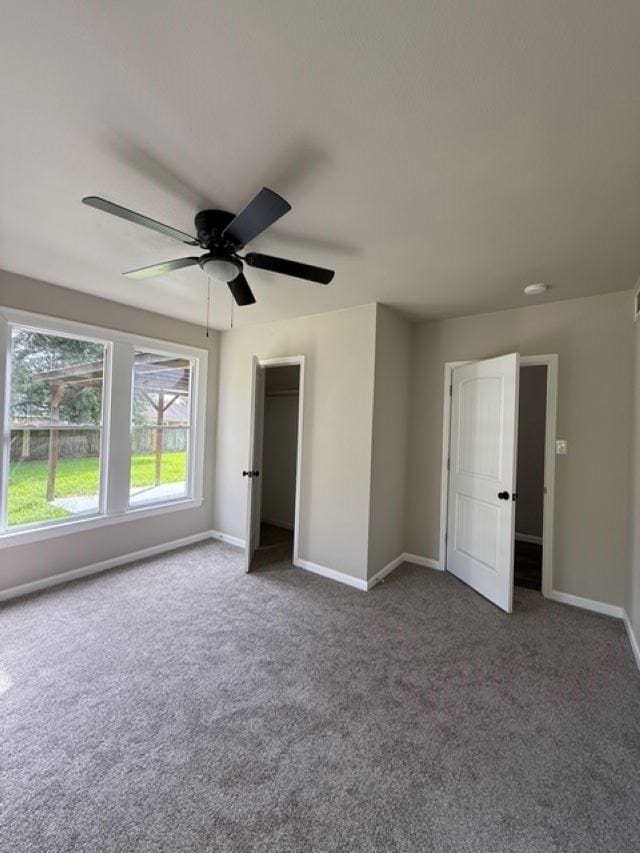 403 3rd St, Nederland, TX 77627 - unfurnished bedroom with carpet flooring, ceiling fan, and a closet