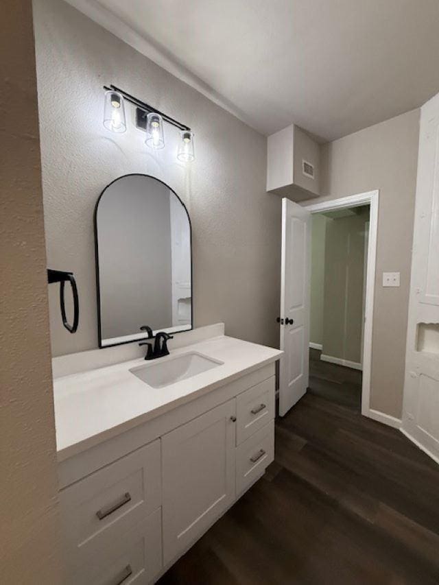 403 3rd St, Nederland, TX 77627 - bathroom featuring wood finished floors and vanity