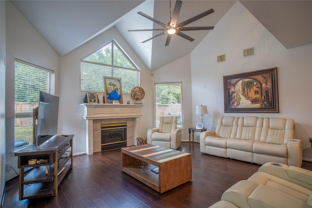 9434 Barretts Glen Ct, Houston, TX 77065 - living room with a ceiling fan, dark wood-style flooring, plenty of natural light, a tile fireplace, and high vaulted ceiling