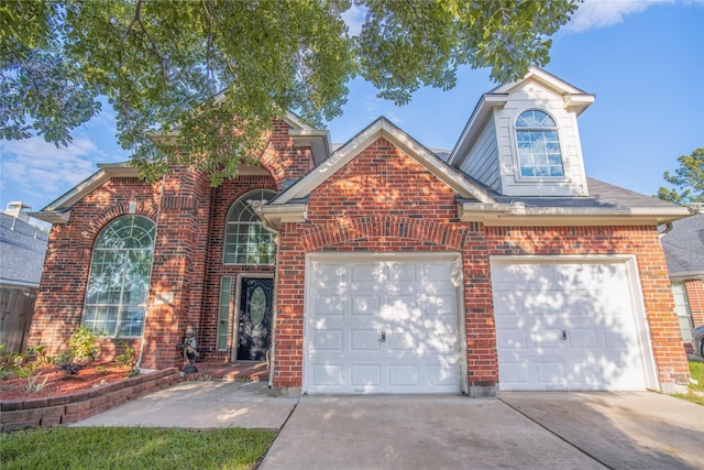 9434 Barretts Glen Ct, Houston, TX 77065 - traditional-style house featuring concrete driveway, brick siding, and an attached garage