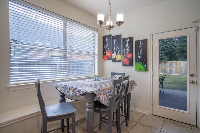 9434 Barretts Glen Ct, Houston, TX 77065 - dining area featuring a chandelier, plenty of natural light, and light tile patterned floors