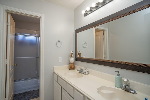 9434 Barretts Glen Ct, Houston, TX 77065 - bathroom with double vanity and combined bath / shower with glass door