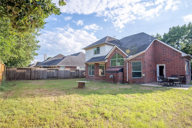 9434 Barretts Glen Ct, Houston, TX 77065 - back of house featuring brick siding, a fenced backyard, and a patio