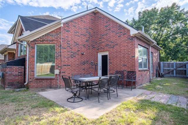 9434 Barretts Glen Ct, Houston, TX 77065 - rear view of house featuring brick siding, a patio, and a gate