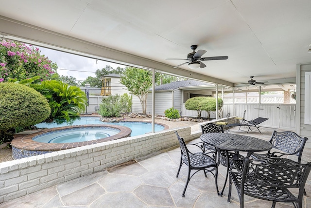 1109 Cheshire Ln, Houston, TX 77018 - view of swimming pool featuring ceiling fan, outdoor dining area, a patio area, and a pool with connected hot tub