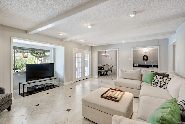 1109 Cheshire Ln, Houston, TX 77018 - living room featuring beam ceiling, a textured ceiling, plenty of natural light, a chandelier, and light tile patterned flooring