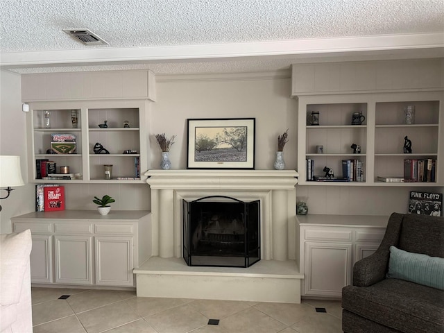 1109 Cheshire Ln, Houston, TX 77018 - living room with a textured ceiling, light tile patterned flooring, a fireplace with raised hearth, built in features, and ornamental molding