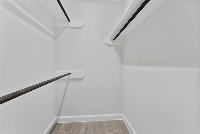 163 W Village Knoll Cir, The Woodlands, TX 77381 - walk in closet featuring light wood finished floors