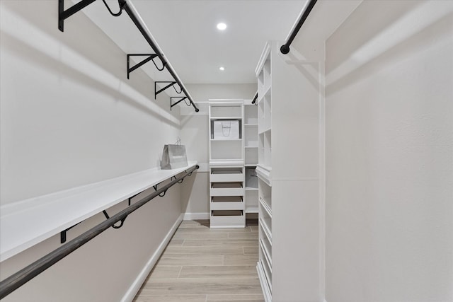 163 W Village Knoll Cir, The Woodlands, TX 77381 - spacious closet with light wood finished floors