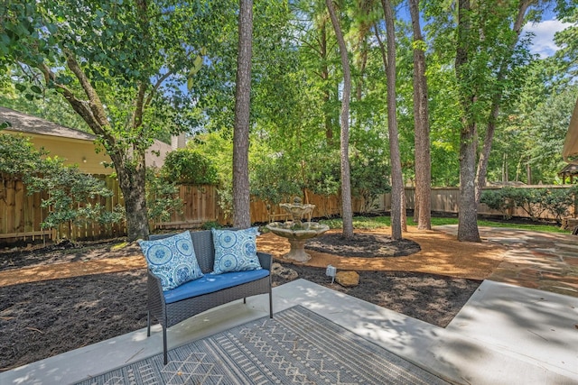 163 W Village Knoll Cir, The Woodlands, TX 77381 - fenced backyard featuring a patio area