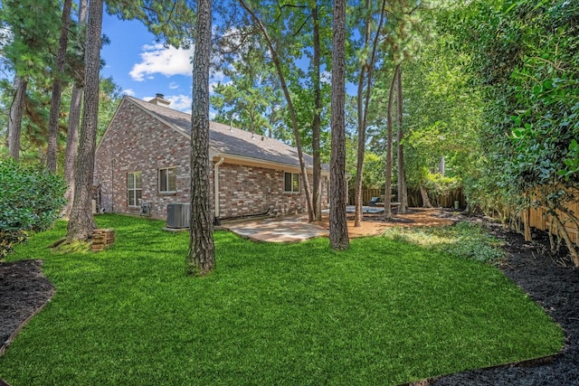 163 W Village Knoll Cir, The Woodlands, TX 77381 - fenced backyard with a patio area