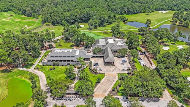 163 W Village Knoll Cir, The Woodlands, TX 77381 - drone / aerial view of a nearby body of water and a golf club
