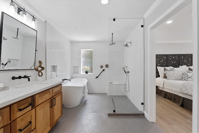163 W Village Knoll Cir, The Woodlands, TX 77381 - full bathroom featuring a tile shower, a freestanding tub, vanity, tile patterned flooring, and ornamental molding