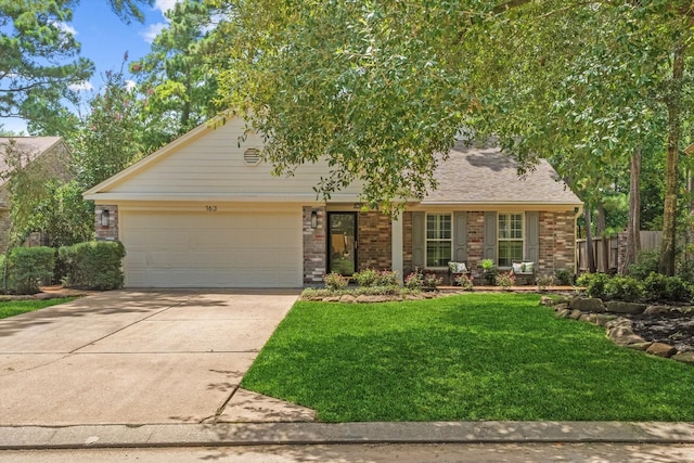 163 W Village Knoll Cir, The Woodlands, TX 77381 - view of front of house with driveway, an attached garage, brick siding, and a shingled roof