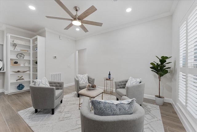 163 W Village Knoll Cir, The Woodlands, TX 77381 - living area featuring a ceiling fan, wood finished floors, ornamental molding, and recessed lighting