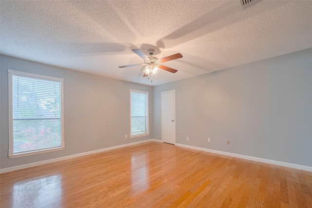 6452 Kentwick Dr, Houston, TX 77084 - unfurnished room with ceiling fan, light wood-type flooring, and a textured ceiling