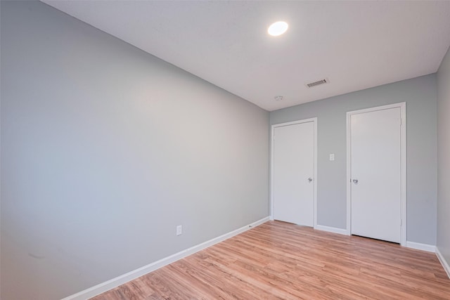 6452 Kentwick Dr, Houston, TX 77084 - unfurnished bedroom with light wood finished floors and baseboards