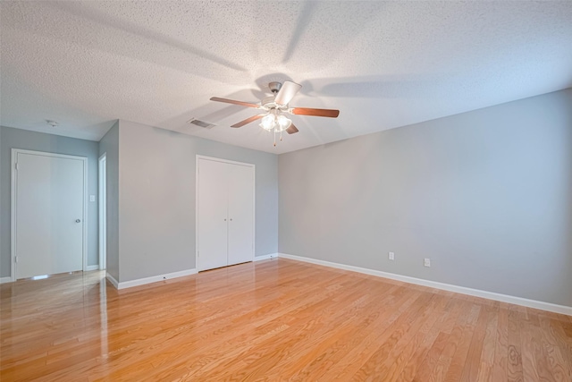 6452 Kentwick Dr, Houston, TX 77084 - spare room featuring a ceiling fan, a textured ceiling, and light wood-style flooring