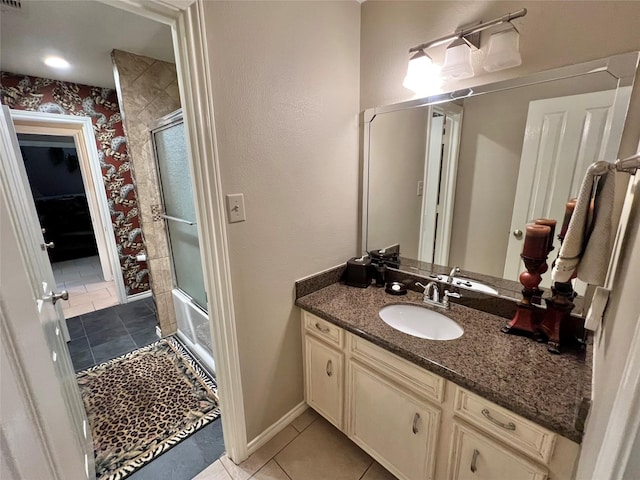 51 S Trillium Ct, Lake Jackson, TX 77566 - full bath with vanity, tile patterned floors, wallpapered walls, and bath / shower combo with glass door