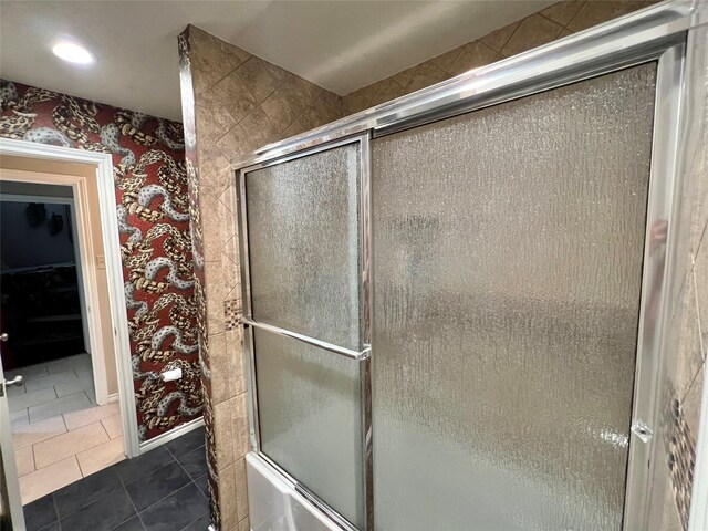 51 S Trillium Ct, Lake Jackson, TX 77566 - bathroom with wallpapered walls, tile patterned floors, and bath / shower combo with glass door