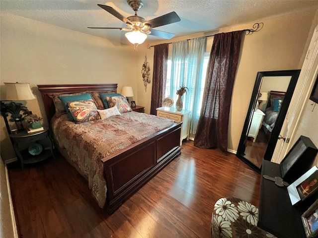 51 S Trillium Ct, Lake Jackson, TX 77566 - bedroom with dark wood-type flooring, a textured ceiling, and ceiling fan
