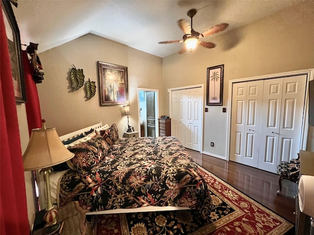 51 S Trillium Ct, Lake Jackson, TX 77566 - bedroom featuring two closets, dark wood finished floors, vaulted ceiling, and a ceiling fan