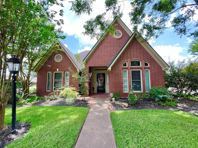 51 S Trillium Ct, Lake Jackson, TX 77566 - view of front facade with brick siding and a front lawn