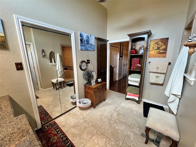 51 S Trillium Ct, Lake Jackson, TX 77566 - bathroom featuring a textured wall and tile patterned flooring