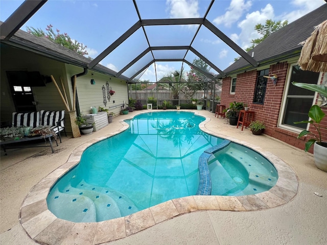 51 S Trillium Ct, Lake Jackson, TX 77566 - view of pool with a pool with connected hot tub, a patio area, a fenced backyard, and a lanai