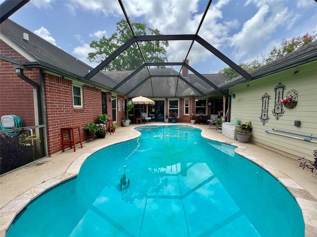 51 S Trillium Ct, Lake Jackson, TX 77566 - swimming pool featuring a patio area and glass enclosure