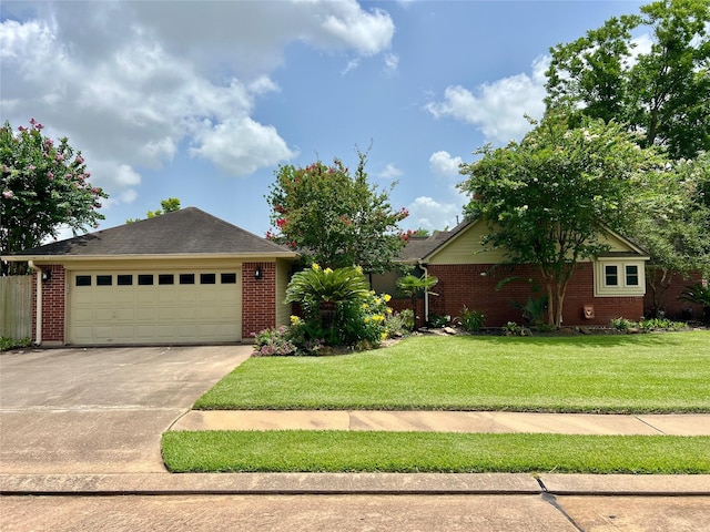 51 S Trillium Ct, Lake Jackson, TX 77566 - ranch-style home with brick siding, a front yard, and concrete driveway