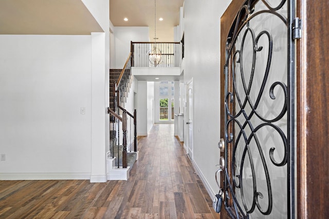 28915 Crested Butte Dr, Katy, TX 77494 - entryway featuring wood finished floors, stairway, and a chandelier