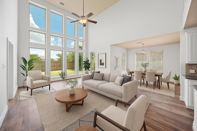 28915 Crested Butte Dr, Katy, TX 77494 - living room with a high ceiling, wood finished floors, healthy amount of natural light, and a ceiling fan
