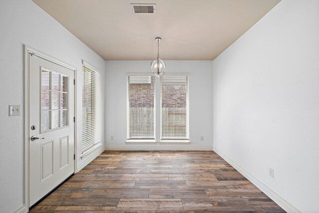 28915 Crested Butte Dr, Katy, TX 77494 - unfurnished dining area featuring a chandelier and dark wood-style floors
