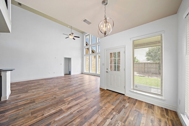 28915 Crested Butte Dr, Katy, TX 77494 - unfurnished dining area featuring a chandelier, ceiling fan, wood finished floors, and high vaulted ceiling