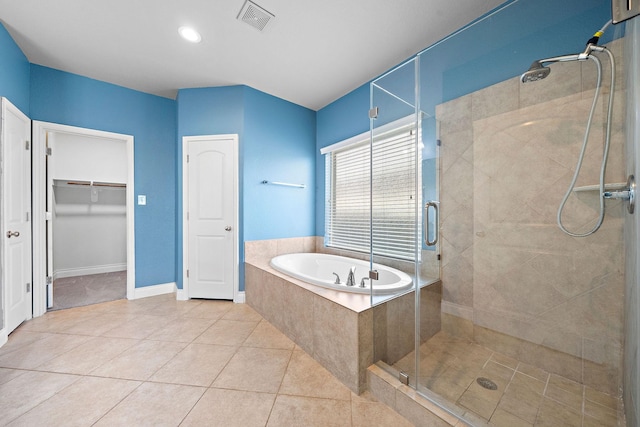 28915 Crested Butte Dr, Katy, TX 77494 - bathroom with a garden tub, a stall shower, tile patterned flooring, and a walk in closet