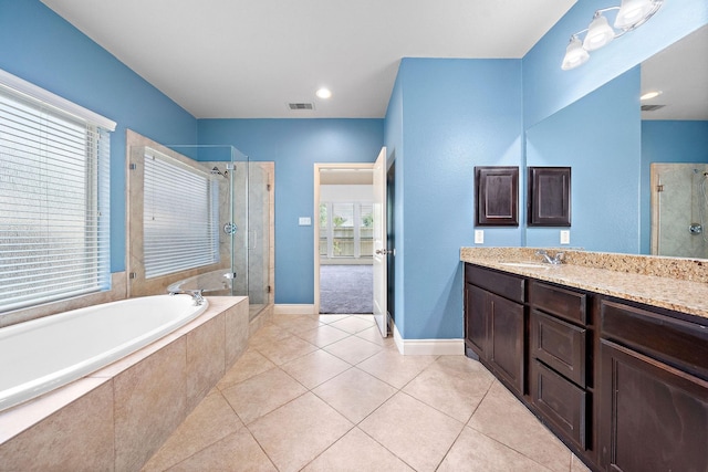 28915 Crested Butte Dr, Katy, TX 77494 - full bathroom featuring vanity, a shower stall, a garden tub, and tile patterned floors