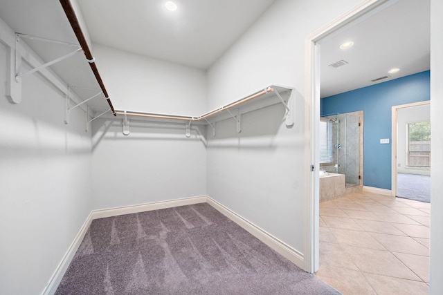 28915 Crested Butte Dr, Katy, TX 77494 - walk in closet with tile patterned floors
