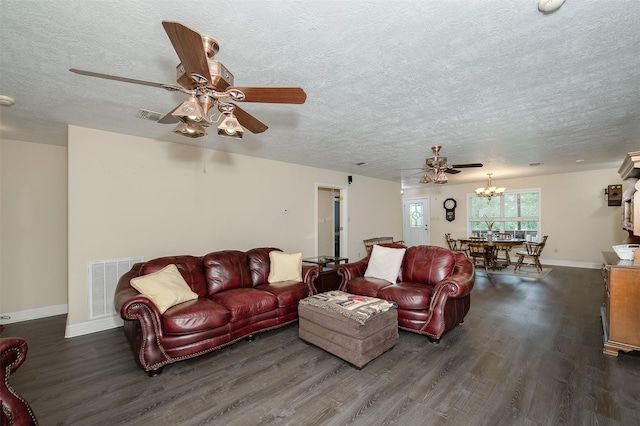 505 Sage Brush Dr, Somerville, TX 77879 - living room with a ceiling fan, wood finished floors, a textured ceiling, and a chandelier
