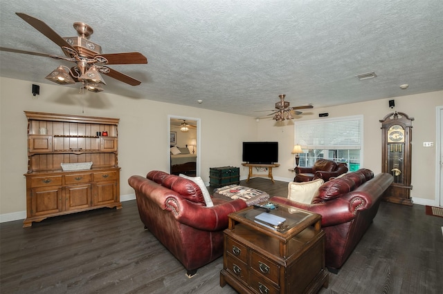 505 Sage Brush Dr, Somerville, TX 77879 - living area with a ceiling fan, dark wood-type flooring, and a textured ceiling