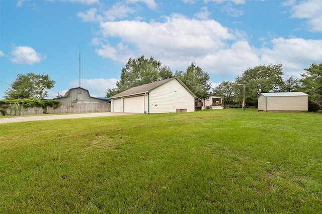 505 Sage Brush Dr, Somerville, TX 77879 - view of grassy yard featuring an outdoor structure and a detached garage