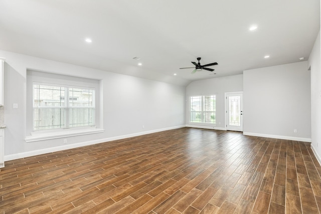 133 Water Grass Trl, Clute, TX 77531 - unfurnished living room with wood finished floors, ceiling fan, recessed lighting, and lofted ceiling