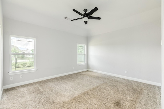 133 Water Grass Trl, Clute, TX 77531 - empty room with plenty of natural light, carpet floors, and a ceiling fan