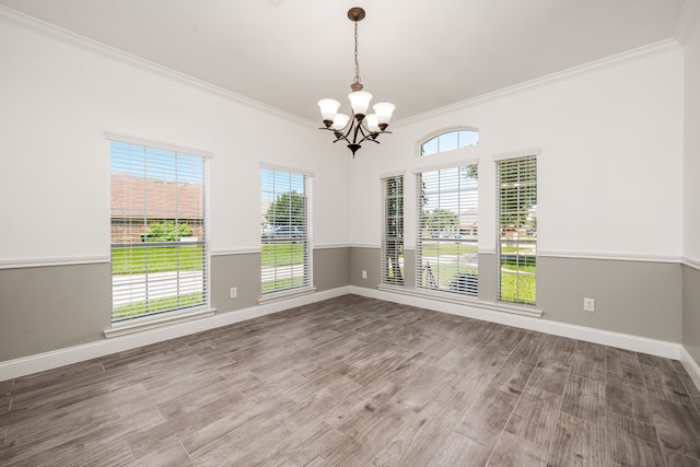 14910 High Meadow Ln, Baytown, TX 77523 - unfurnished room featuring ornamental molding, a chandelier, and wood finished floors
