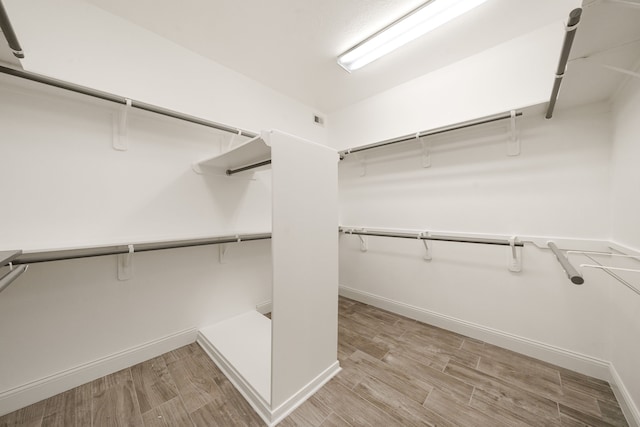 14910 High Meadow Ln, Baytown, TX 77523 - spacious closet with light wood-style flooring