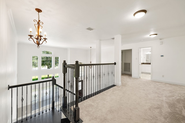 14910 High Meadow Ln, Baytown, TX 77523 - hall featuring carpet floors, a chandelier, and an upstairs landing