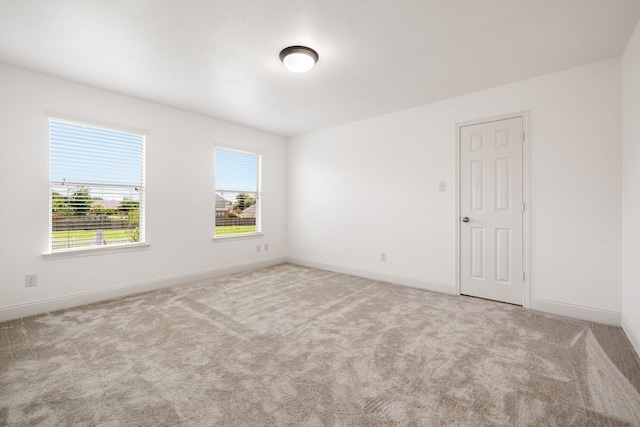 14910 High Meadow Ln, Baytown, TX 77523 - carpeted empty room with baseboards