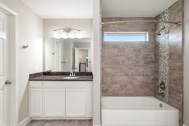 14910 High Meadow Ln, Baytown, TX 77523 - full bath featuring bathing tub / shower combination, vanity, and wood finished floors