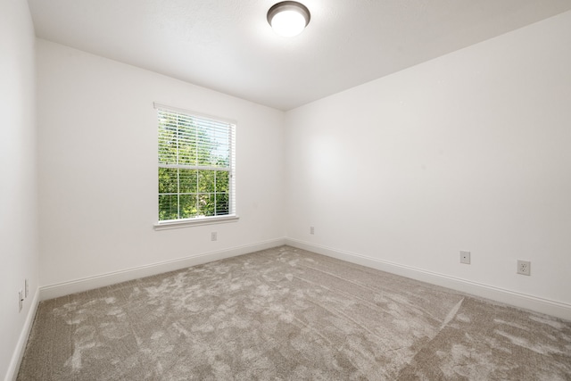 14910 High Meadow Ln, Baytown, TX 77523 - empty room featuring carpet floors and baseboards