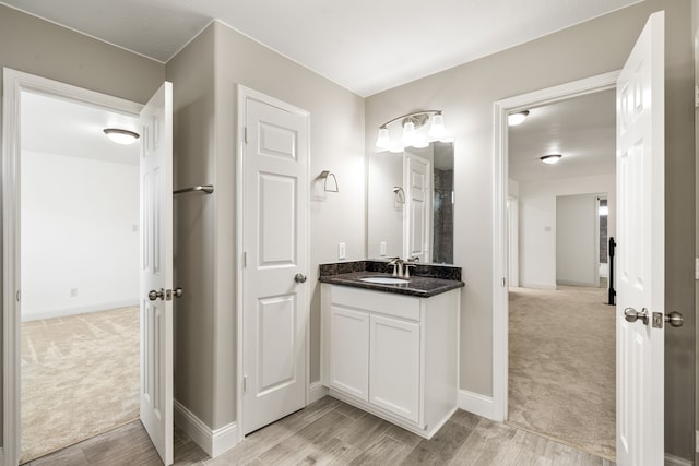 14910 High Meadow Ln, Baytown, TX 77523 - bathroom featuring vanity and wood finished floors